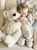 ClaraLoo large plush bear with white faux fur. This bear has white fur with cream colored crocheted ears, muzzle, hands, and feet. This handmade polar bear has a black nose.